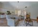 Cozy living room area open to a modern kitchen, featuring hardwood floors and comfortable seating at 83 Malcom Rd, Covington, GA 30014