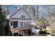 The back of the house has gray siding, a wooden deck with stairs, and a screen door at 1194 Kendrick Ne Rd, Atlanta, GA 30319