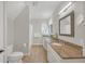 Bright bathroom featuring double sinks, granite countertops and decorative mirror at 1194 Kendrick Ne Rd, Atlanta, GA 30319