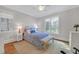 Cozy bedroom featuring a ceiling fan, two windows and light-toned walls at 1194 Kendrick Ne Rd, Atlanta, GA 30319