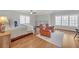 Spacious bedroom features hardwood floors, lots of natural light, seating area and ceiling fan at 1194 Kendrick Ne Rd, Atlanta, GA 30319