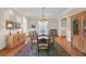 Formal dining room featuring hardwood floors, chandelier, and wainscoting at 1194 Kendrick Ne Rd, Atlanta, GA 30319