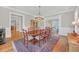 Elegant dining area with hardwood floors, neutral color palette, and seamless access to the living room at 1194 Kendrick Ne Rd, Atlanta, GA 30319