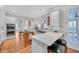 Open kitchen with stainless appliances, breakfast bar, and hardwood floors at 1194 Kendrick Ne Rd, Atlanta, GA 30319