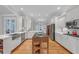Bright kitchen with white cabinets, stainless steel appliances, and island at 1194 Kendrick Ne Rd, Atlanta, GA 30319