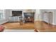 Living room featuring a fireplace, hardwood floors, a view of a door and built-in cabinetry at 1194 Kendrick Ne Rd, Atlanta, GA 30319