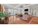 Spacious living room with hardwood floors, fireplace, and multiple French doors at 1194 Kendrick Ne Rd, Atlanta, GA 30319