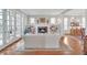 Bright living room with fireplace, built-in shelving, and hardwood flooring at 1194 Kendrick Ne Rd, Atlanta, GA 30319