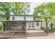 Backyard view featuring a screened porch, wood deck, and the home's rear exterior at 2911 Bentwood Dr, Marietta, GA 30062