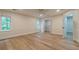 Spacious bedroom with light wood floors, a ceiling fan, and a walk-in closet for ample storage at 2911 Bentwood Dr, Marietta, GA 30062