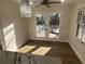 Dining area with wood floors, stylish lighting, and doors leading to the deck at 2911 Bentwood Dr, Marietta, GA 30062