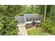 Well-manicured front yard with a two-story home, brick pathway, and two car garage at 2911 Bentwood Dr, Marietta, GA 30062