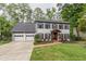 Traditional two-story home featuring a two car garage and manicured front lawn at 2911 Bentwood Dr, Marietta, GA 30062