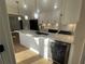 Updated kitchen features marble counters, white cabinets, stainless appliances, and island with sink at 2911 Bentwood Dr, Marietta, GA 30062
