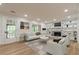 Staged living room boasting hardwood floors, fireplace with built-in shelves, and comfortable furniture arrangement at 2911 Bentwood Dr, Marietta, GA 30062