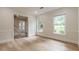 Spacious living room with wood floors and plenty of windows offering views of landscaped yard at 2911 Bentwood Dr, Marietta, GA 30062
