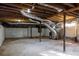 Spacious basement with exposed wood beams, ductwork, and concrete block walls at 3512 Fairlane Nw Dr, Atlanta, GA 30331