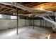 Spacious basement with exposed wood beams, ductwork, and concrete block walls at 3512 Fairlane Nw Dr, Atlanta, GA 30331