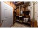 Unfinished basement with exposed wood framing, open shelves, and unfinished flooring offers potential for customization at 3512 Fairlane Nw Dr, Atlanta, GA 30331