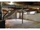 Spacious basement with exposed wood beams, ductwork, concrete block walls and mechanicals at 3512 Fairlane Nw Dr, Atlanta, GA 30331