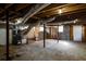 Spacious basement with exposed wood beams, ductwork, and concrete block walls at 3512 Fairlane Nw Dr, Atlanta, GA 30331