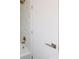 Bathroom features marble patterned shower tiles, brass fixtures, and white door with modern hardware at 3512 Fairlane Nw Dr, Atlanta, GA 30331