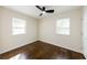 Bedroom featuring hardwood floors, ceiling fan, and natural light at 3512 Fairlane Nw Dr, Atlanta, GA 30331