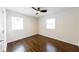 Bedroom featuring hardwood floors, ceiling fan, and natural light at 3512 Fairlane Nw Dr, Atlanta, GA 30331