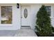 Close-up of a white front door with decorative glass and neat landscaping at 3512 Fairlane Nw Dr, Atlanta, GA 30331