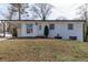 Charming brick home featuring a welcoming front yard and a convenient carport at 3512 Fairlane Nw Dr, Atlanta, GA 30331