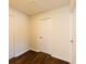 Clean hallway with dark stained hardwood floors and three white doors at 3512 Fairlane Nw Dr, Atlanta, GA 30331