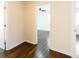 Hallway featuring hardwood floors and doorway to bedroom with ceiling fan at 3512 Fairlane Nw Dr, Atlanta, GA 30331