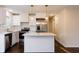 Bright kitchen featuring white cabinets, stainless steel appliances, and a center island with quartz countertops at 3512 Fairlane Nw Dr, Atlanta, GA 30331