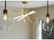 Close up of modern and stylish pendant lights with wooden floors and neutral walls at 3512 Fairlane Nw Dr, Atlanta, GA 30331