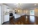 Bright and airy living space with hardwood floors, opening to a modern kitchen at 3512 Fairlane Nw Dr, Atlanta, GA 30331