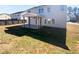 Spacious backyard featuring covered patio, level lawn, and privacy fence at 362 Reserve Overlook, Canton, GA 30115