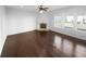 This home features a bright living room, large windows, hardwood floors, and a cozy fireplace at 362 Reserve Overlook, Canton, GA 30115