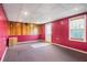 Finished basement area with a window and drop ceiling tiles at 540 Clubfield Drive, Roswell, GA 30075