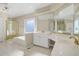 Bright bathroom features dual sinks, garden tub, and lots of counter space at 540 Clubfield Drive, Roswell, GA 30075