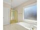 Bathroom featuring soaking tub, shower, and bright window at 540 Clubfield Drive, Roswell, GA 30075