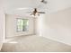 Bright bedroom featuring a ceiling fan and a large window that allows for plenty of natural light at 540 Clubfield Drive, Roswell, GA 30075