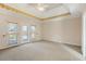 Expansive bedroom features a private outdoor access with neutral carpeting at 540 Clubfield Drive, Roswell, GA 30075