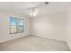 Bright bedroom with neutral walls, carpet, and a window at 540 Clubfield Drive, Roswell, GA 30075