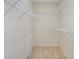 Walk-in closet featuring built-in shelving at 540 Clubfield Drive, Roswell, GA 30075