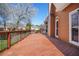 View from the deck, featuring wooden floors, black railings, and a cozy space at 540 Clubfield Drive, Roswell, GA 30075