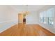 Elegant dining room with hardwood floors, large windows, and chandelier, perfect for entertaining at 540 Clubfield Drive, Roswell, GA 30075