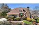 Charming two-story home with landscaped yard, stone accents, and a well-manicured lawn at 540 Clubfield Drive, Roswell, GA 30075
