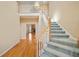 Inviting foyer with hardwood floors, staircase, and open view to living area, showcasing the home's layout at 540 Clubfield Drive, Roswell, GA 30075