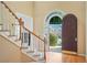 Foyer area showcasing the front door and stairs at 540 Clubfield Drive, Roswell, GA 30075