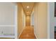 Hallway features hardwood floors and neutral walls, connecting rooms with ease at 540 Clubfield Drive, Roswell, GA 30075
